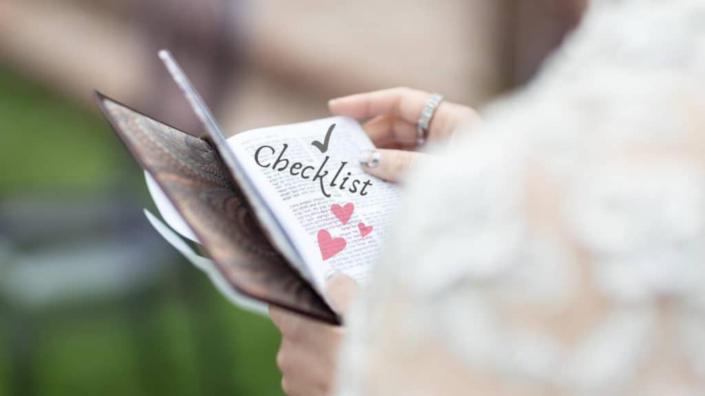 Bride holding a checklist book